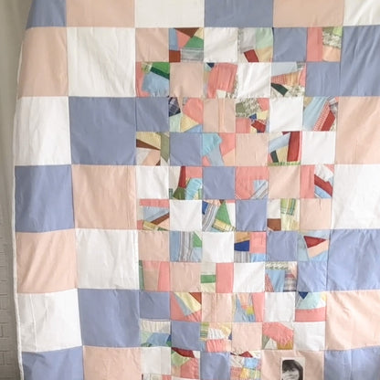 Keepsake quilt squares sewn from saved clothes